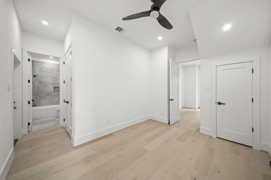 Perfect as a third bedroom, this space could easily serve as a study, home office or private guest suite. An additional closet with double doors sits just outside the bath plus a door leading to the back allows access to the backyard.