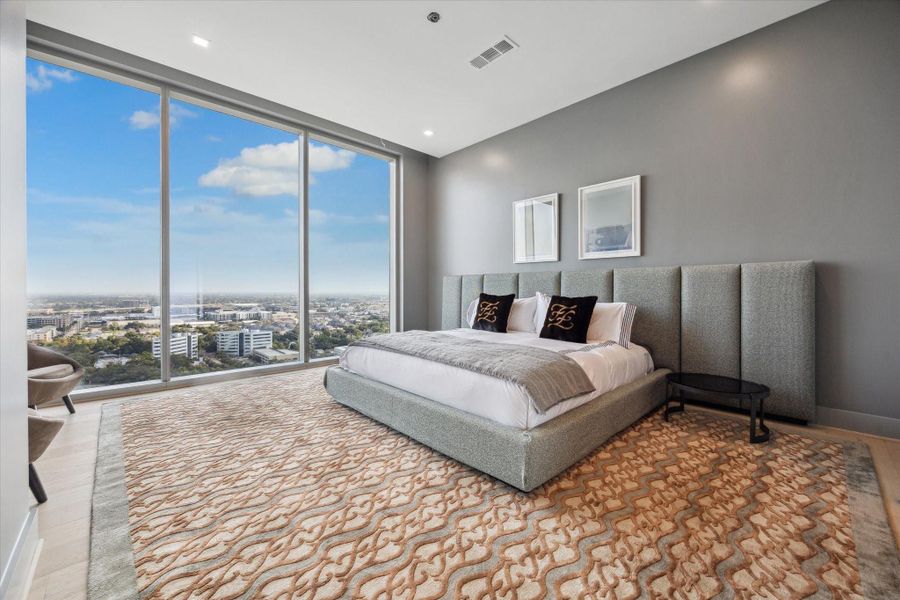 Primary retreat with walk-in closet, edgeless shower and large soaking tub.