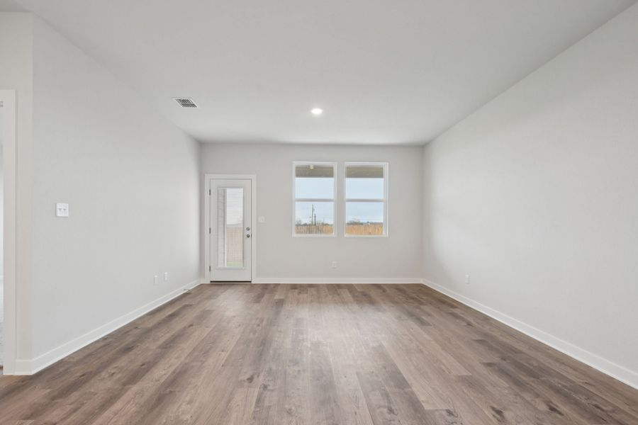 A room with a wood floor and a wood floor.