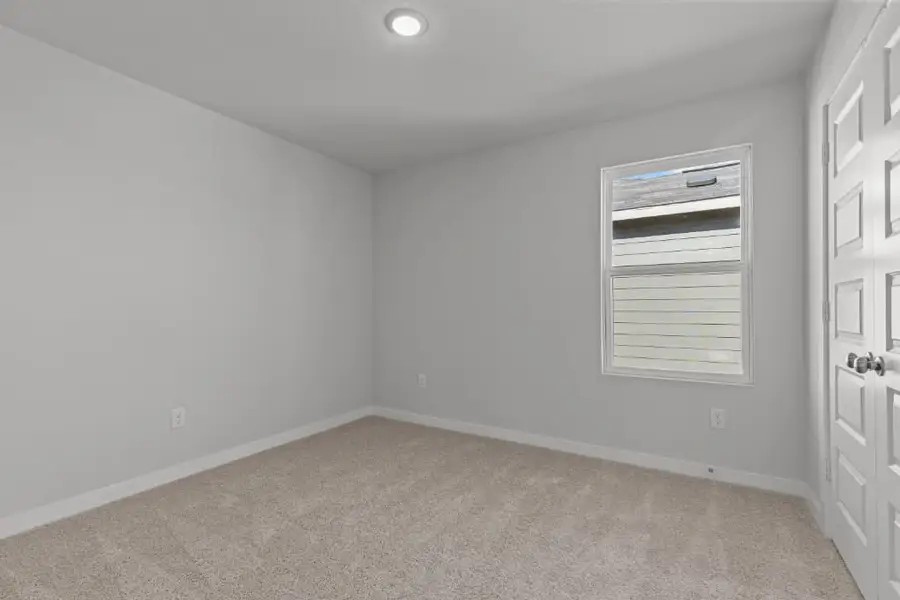 A room with a door and a window. A room with a door and a window.