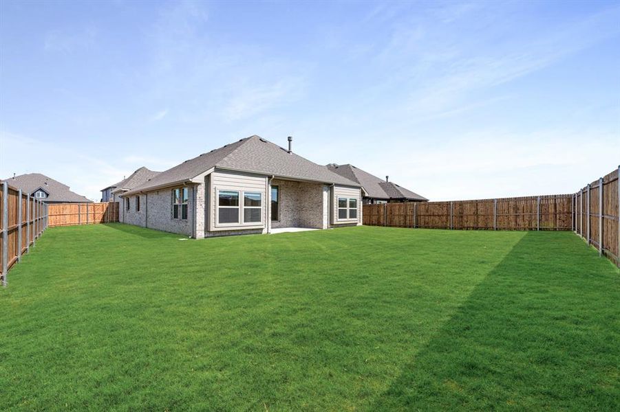 Exterior details and patio area of a home in East Oak Creek 50-55, Commerce (Image 21).