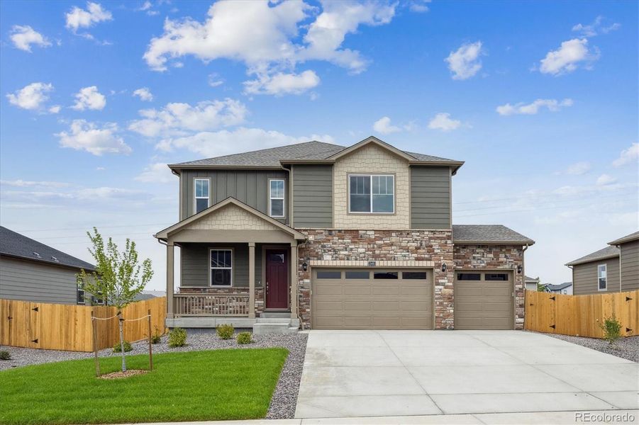 Front exterior of a new home in Timberleaf, Thornton, CO, highlighting curb appeal (Image 2).