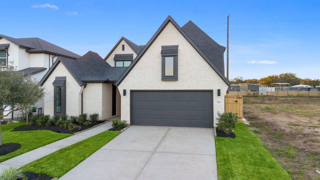 Front exterior of a new home in Sienna 45', 50', Missouri City, TX, highlighting curb appeal (Image 20). Front exterior of a new home in Sienna 45', 50', Missouri City, TX, highlighting curb appeal (Image 20).