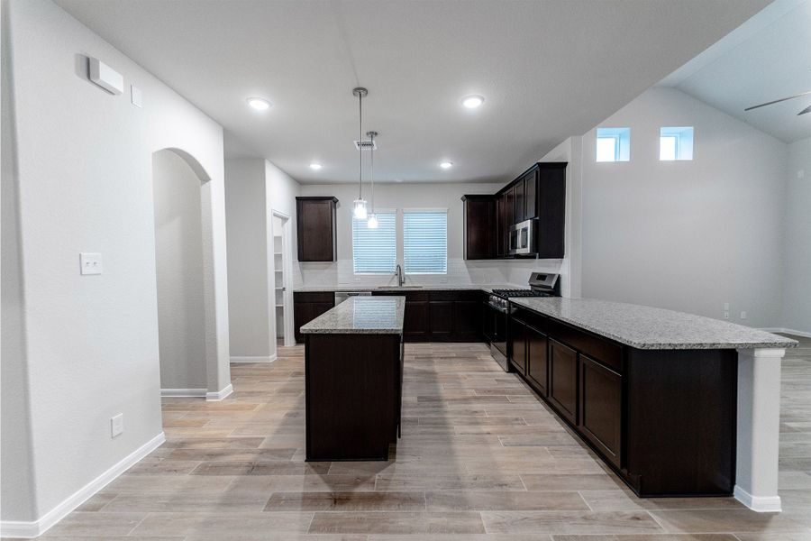 Furnished interior view inside a new home in Creekhaven, Iowa Colony (Image 3).