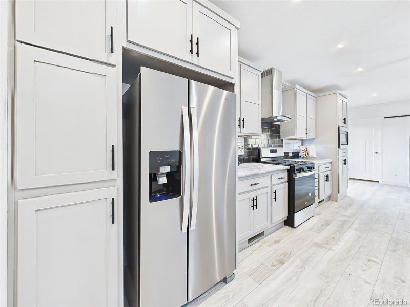 Abundant cabinet storage, built-in microwave, and refrigerator with ice/water dispenser. Abundant cabinet storage, built-in microwave, and refrigerator with ice/water dispenser.