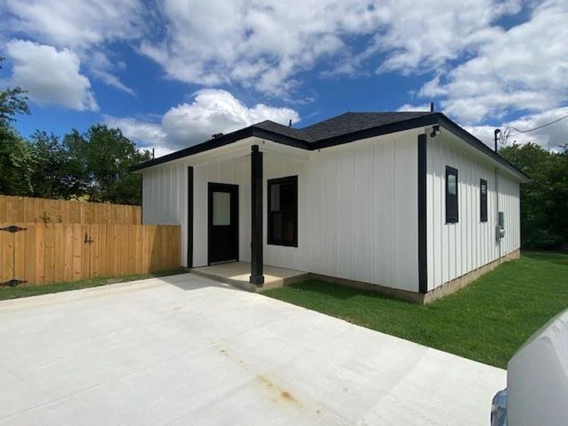 A newly built residence with a clean, contemporary facade and a private backyard. A newly built residence with a clean, contemporary facade and a private backyard.