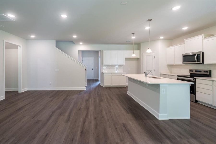 The new home Hartwell showcases a beautiful and spacious kitchen. The new home Hartwell showcases a beautiful and spacious kitchen.