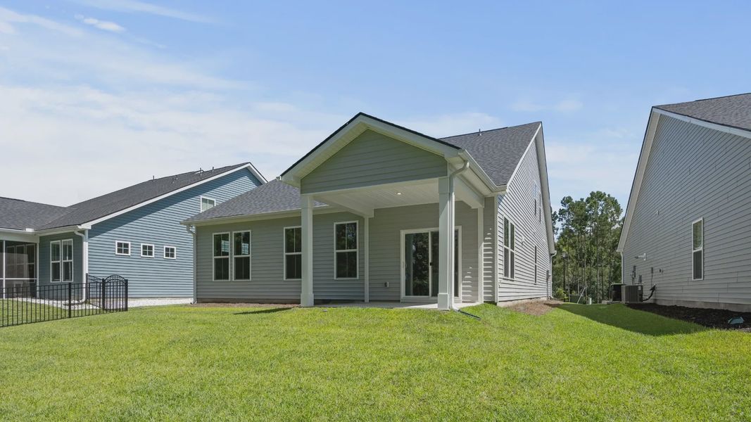 Front exterior of a new home in Bluffs at Sun Colony, Longs, SC, highlighting curb appeal (Image 2).