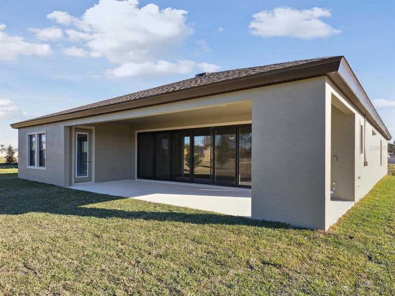 Exterior details and patio area of a home in Caldera, Spring Hill (Image 3).