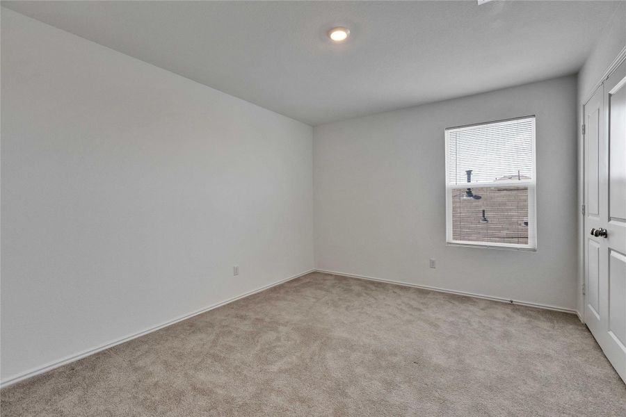 Upstairs bedroom with a walk in closet. Upstairs bedroom with a walk in closet.