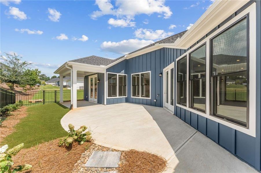 Exterior details and patio area of a home in The Courtyards at Redbud Lane, Holly Springs (Image 18). Exterior details and patio area of a home in The Courtyards at Redbud Lane, Holly Springs (Image 18).