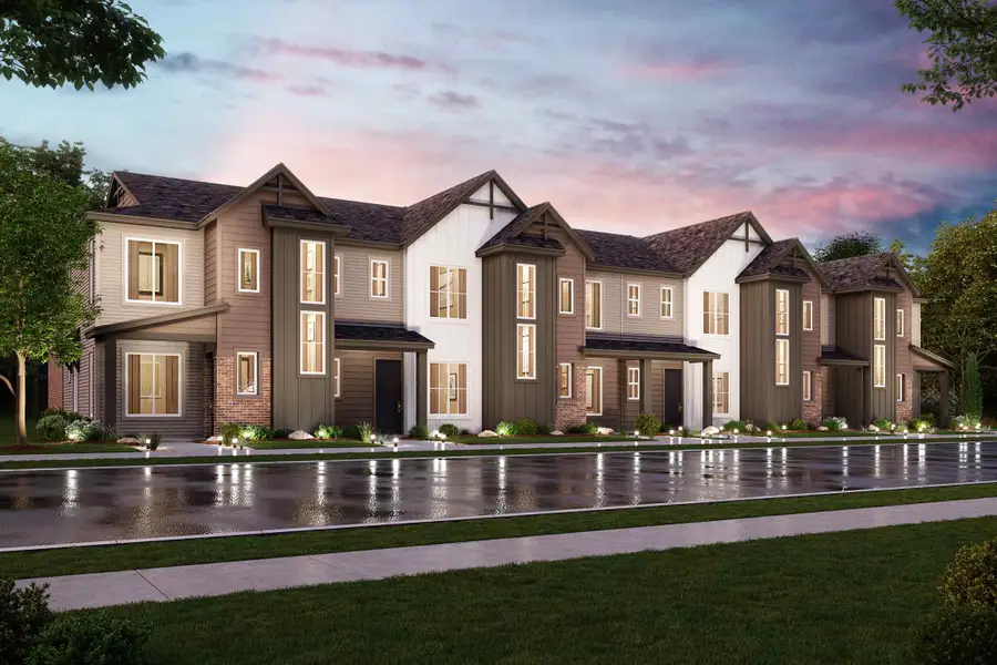 A large house with a pond in front of it. A large house with a pond in front of it.