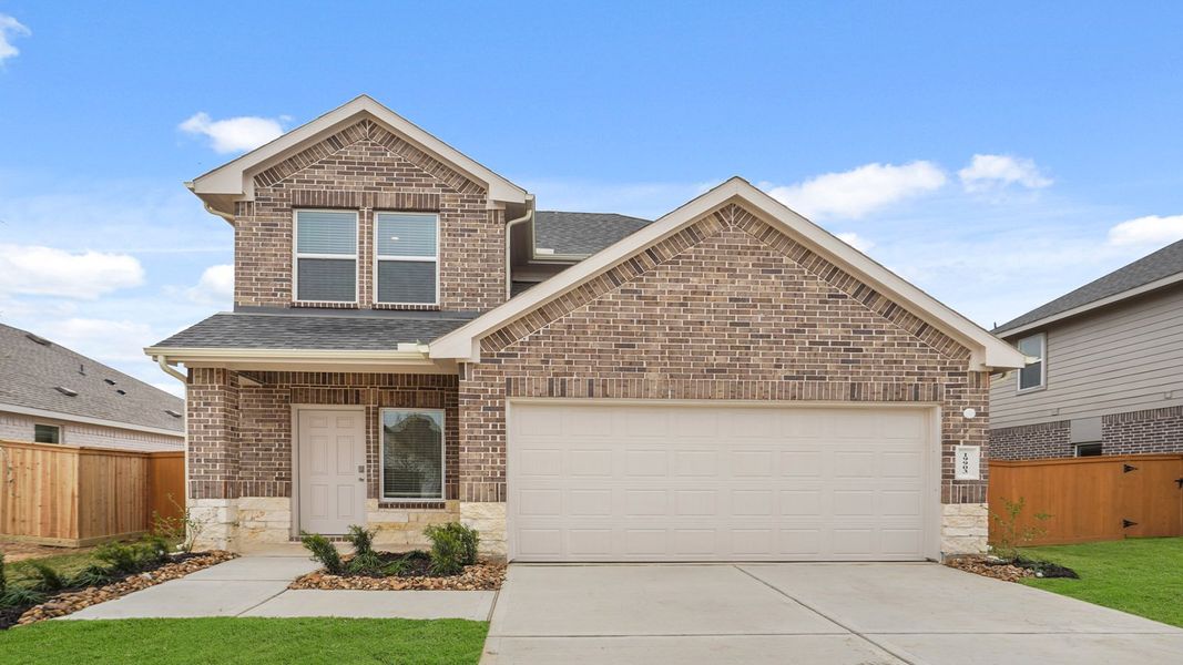 Representative exterior photo of a completed home built from the E30J by D.R. Horton in Cypress Green, Hockley, TX (Image 1).