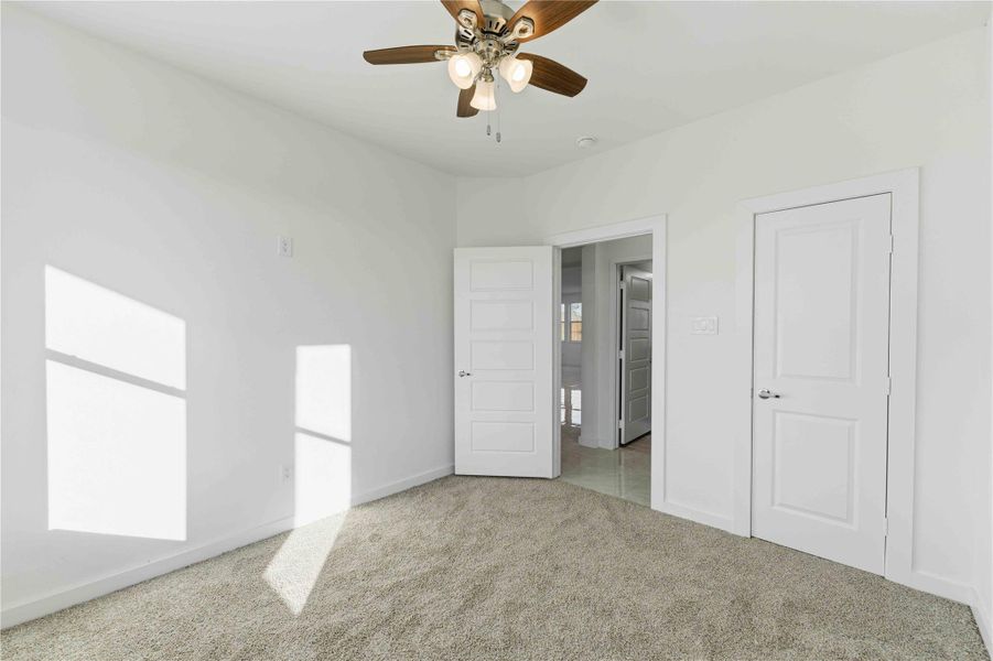 Versatile first floor room ideal for a home office, study, or guest bedroom. Bright and inviting with large windows, plush carpeting, and a ceiling fan, this flexible space adapts perfectly to your lifestyle whether for work, learning, or rest
