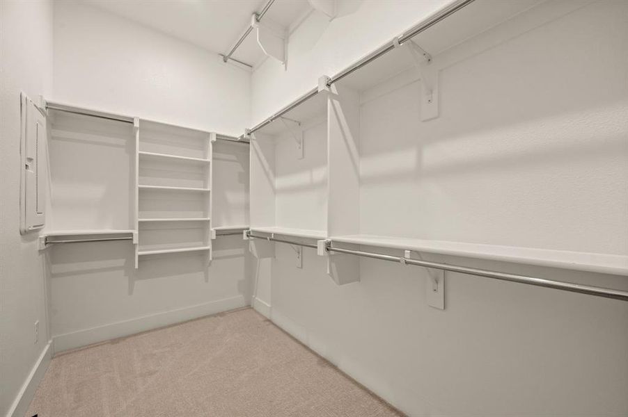 Your dream closet features great storage, plenty of hanging space and bonus seasonal hanging racks!