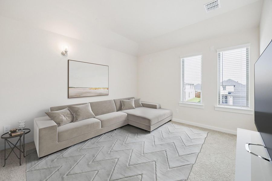 A well-lit living area features neutral carpeting, a plush sectional, and multiple windows. A well-lit living area features neutral carpeting, a plush sectional, and multiple windows.