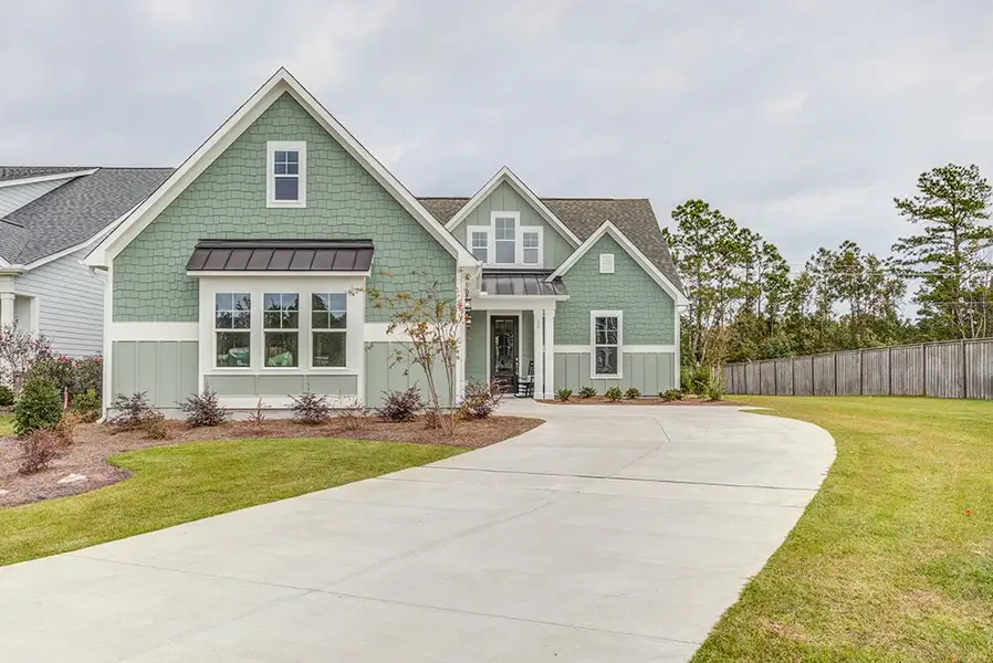 Representative exterior photo of a completed home built from the The Amherst by RobuckHomes in Windwater, Hampstead, NC (Image 2).