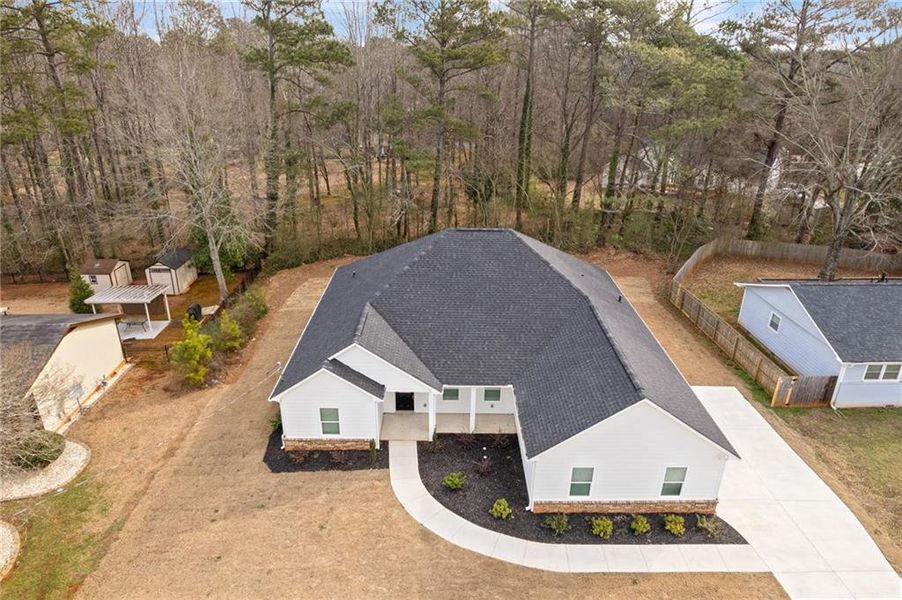 Front exterior of a new home in , Lithonia, GA, highlighting curb appeal (Image 23).
