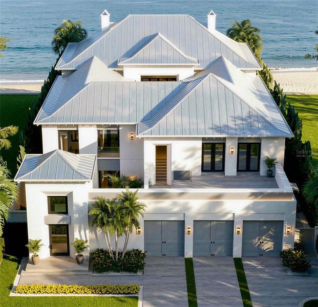 Front exterior of a new home in , Belleair Beach, FL, highlighting curb appeal (Image 6). Front exterior of a new home in , Belleair Beach, FL, highlighting curb appeal (Image 6).