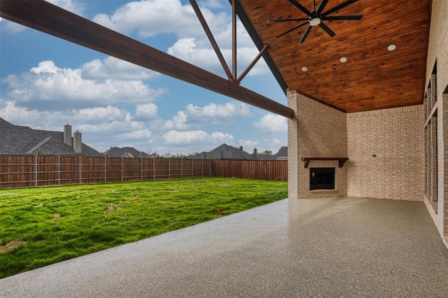 Stunning covered patio with fireplace.