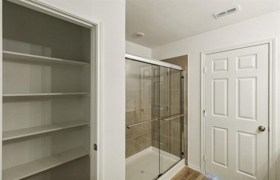 Owner's bath with oversized shower*real home pictured