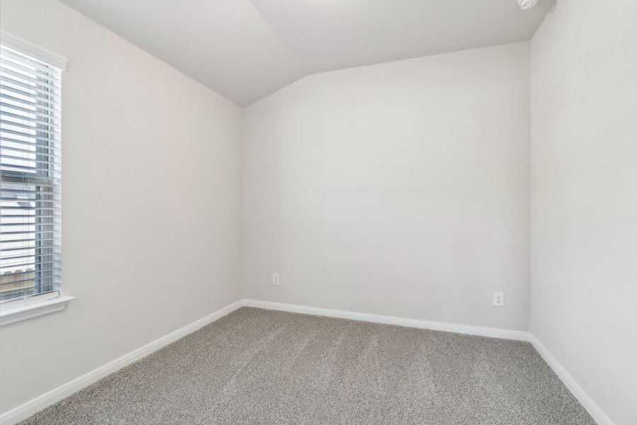 Guest bedroom in the Briscoe floorplan at a Meritage Homes community.