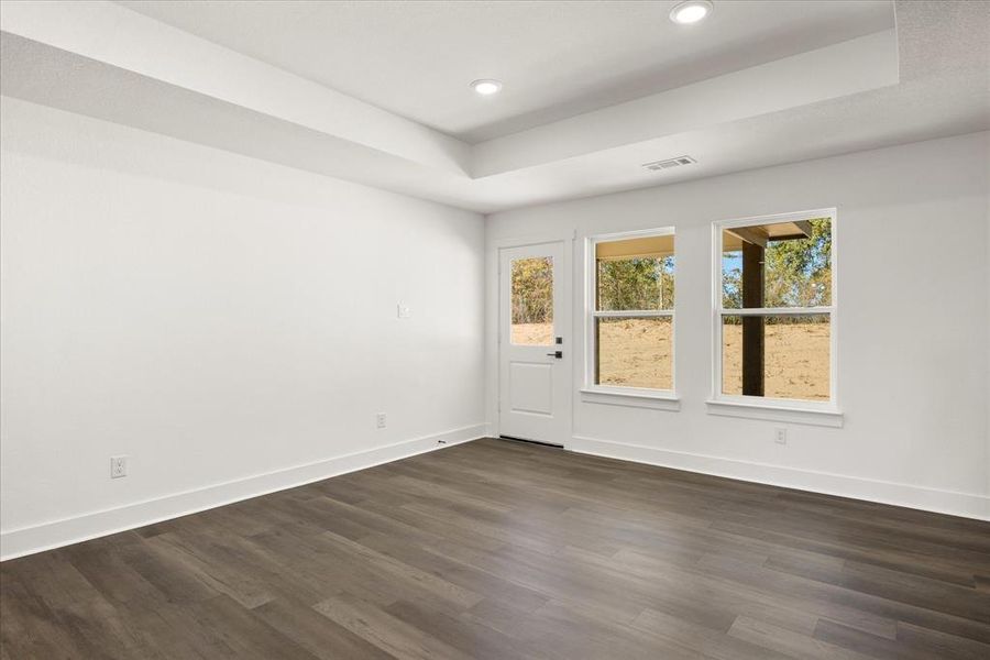 Living room with access to covered back porch. Living room with access to covered back porch.