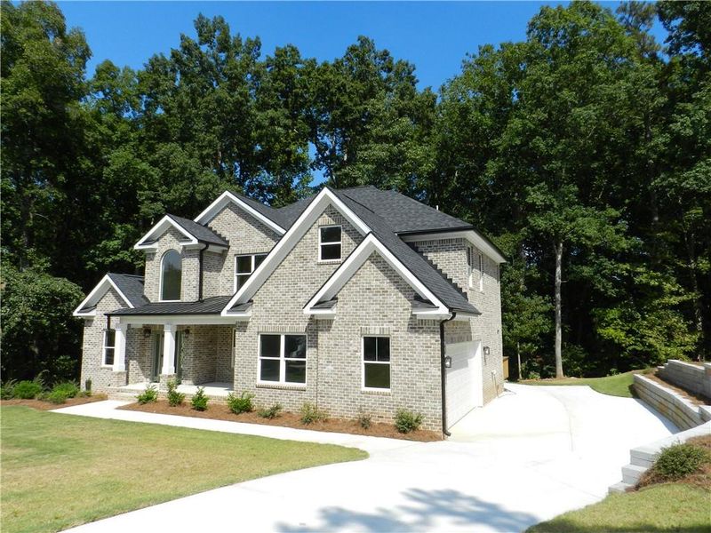 Front exterior of a new home in , McDonough, GA, highlighting curb appeal (Image 2). Front exterior of a new home in , McDonough, GA, highlighting curb appeal (Image 2).