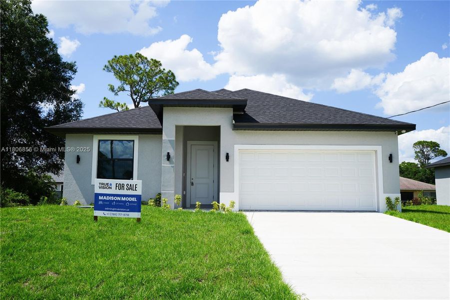 Front exterior of a new home in , Labelle, FL, highlighting curb appeal (Image 1).