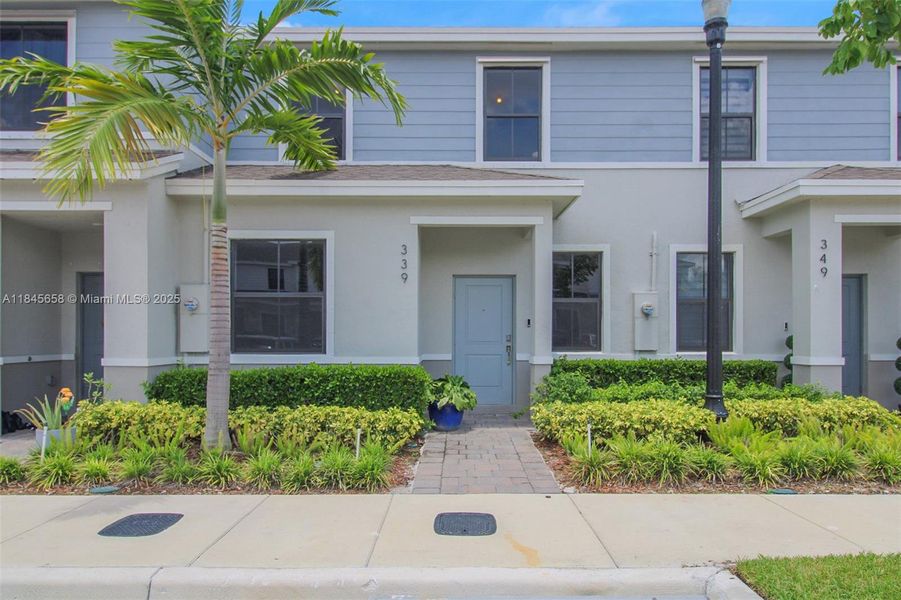 Front exterior of a new home in , Florida City, FL, highlighting curb appeal (Image 10).