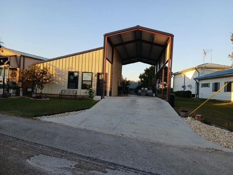 Front view of home with large RV parking