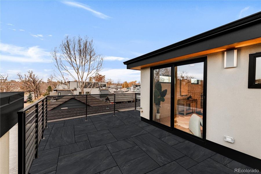 The rooftop deck with fabulous mountain views and padded deck tiles has water, gas, and electric connections for all your entertaining needs!