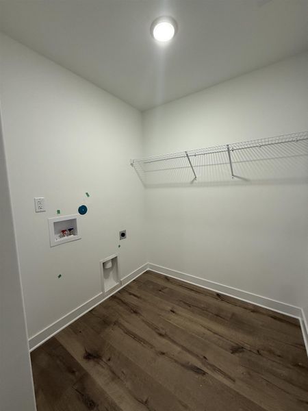 Laundry area featuring hookup for an electric dryer, dark wood finished floors, and washer hookup
