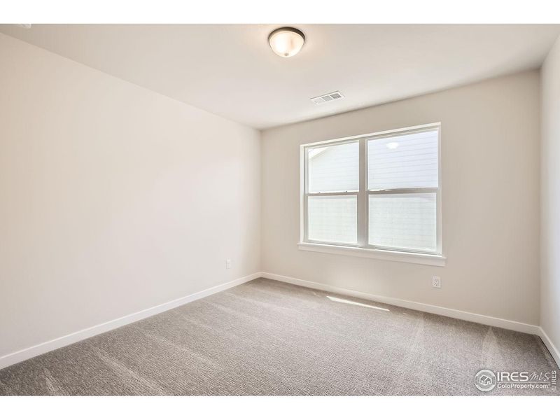 Spacious, unfurnished interior of a new home in RainDance, Windsor (Image 26).
