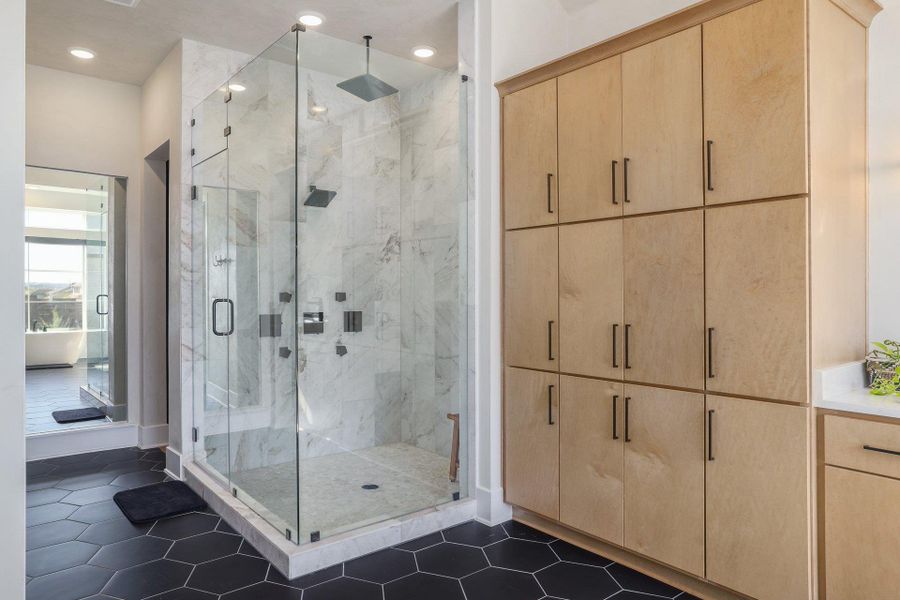 An oversized walk-in shower and thoughtfully designed layout elevate the everyday routine.