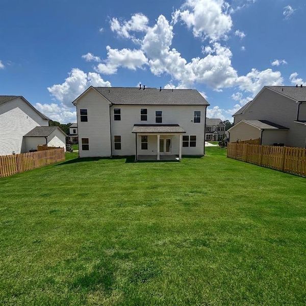 Exterior details and patio area of a home in Rosewood Lake Estates, Hoschton (Image 32).
