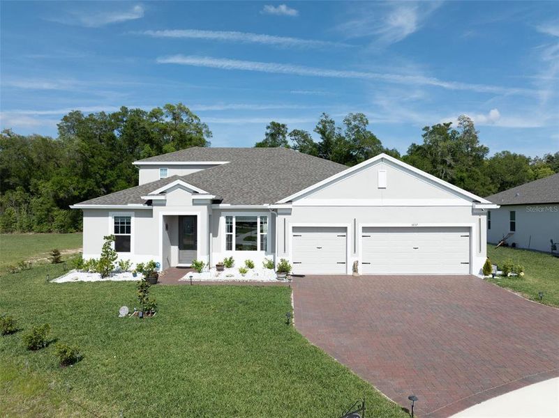 Front exterior of a new home in , Mount Dora, FL, highlighting curb appeal (Image 24).