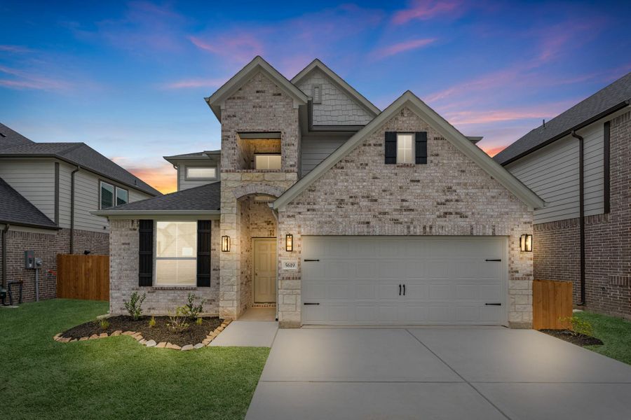 Front exterior of a new home in Grand Mason Crossing, Katy, TX, highlighting curb appeal (Image 1). Front exterior of a new home in Grand Mason Crossing, Katy, TX, highlighting curb appeal (Image 1).