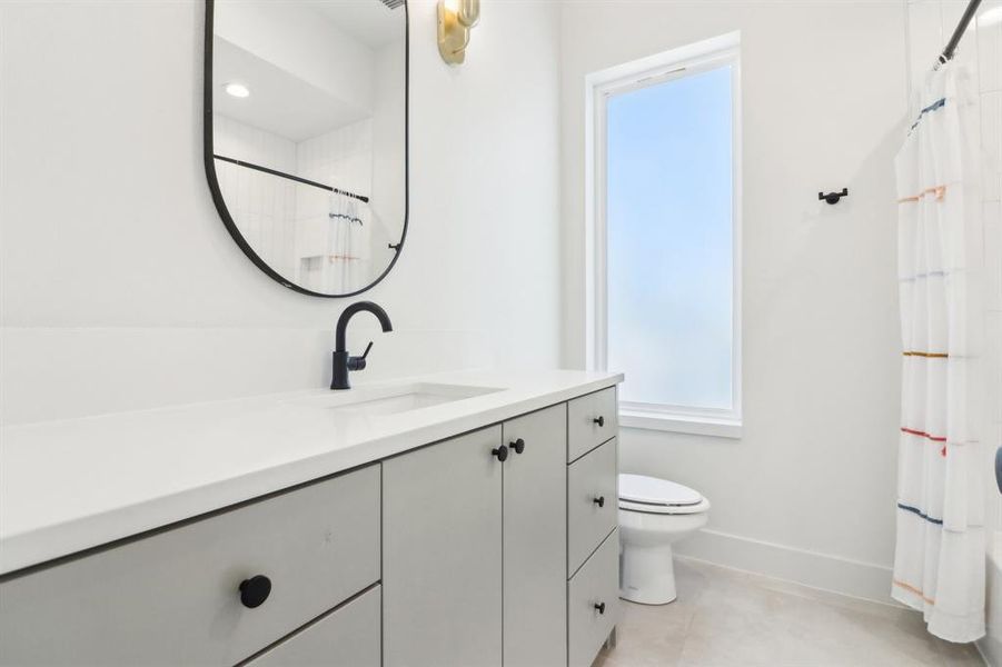 Bathroom featuring toilet and vanity