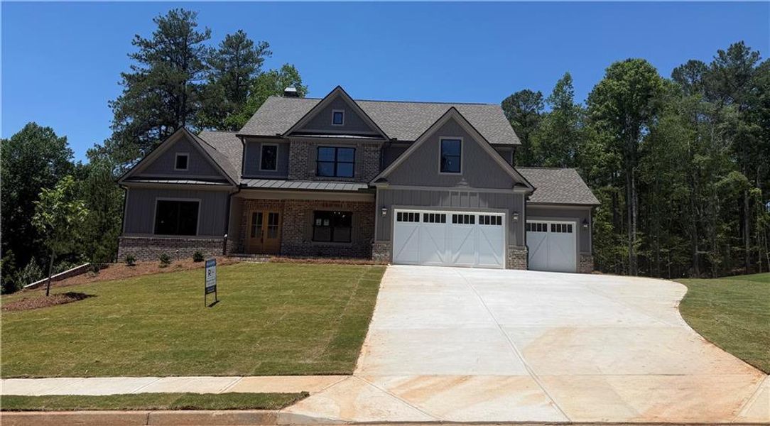 Front exterior of a new home in Spring Creek, Monroe, GA, highlighting curb appeal (Image 1). Front exterior of a new home in Spring Creek, Monroe, GA, highlighting curb appeal (Image 1).