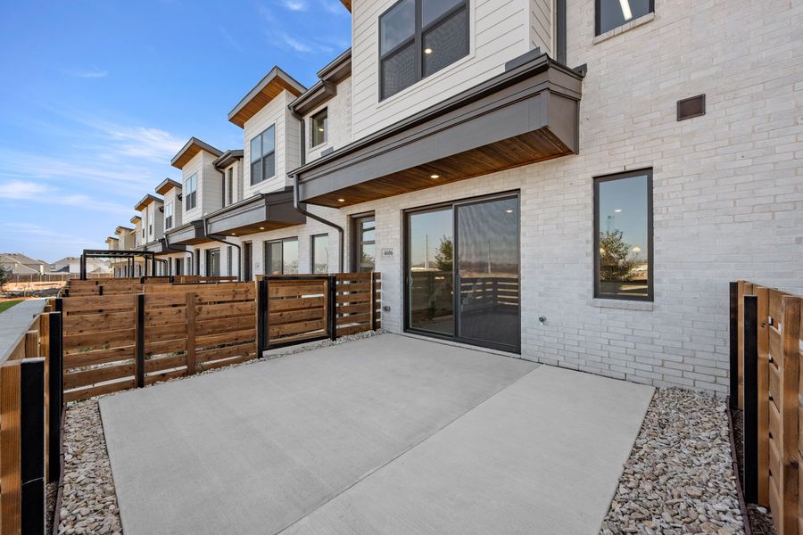 Exterior details and patio area of a home in Wildridge, Oak Point (Image 4).