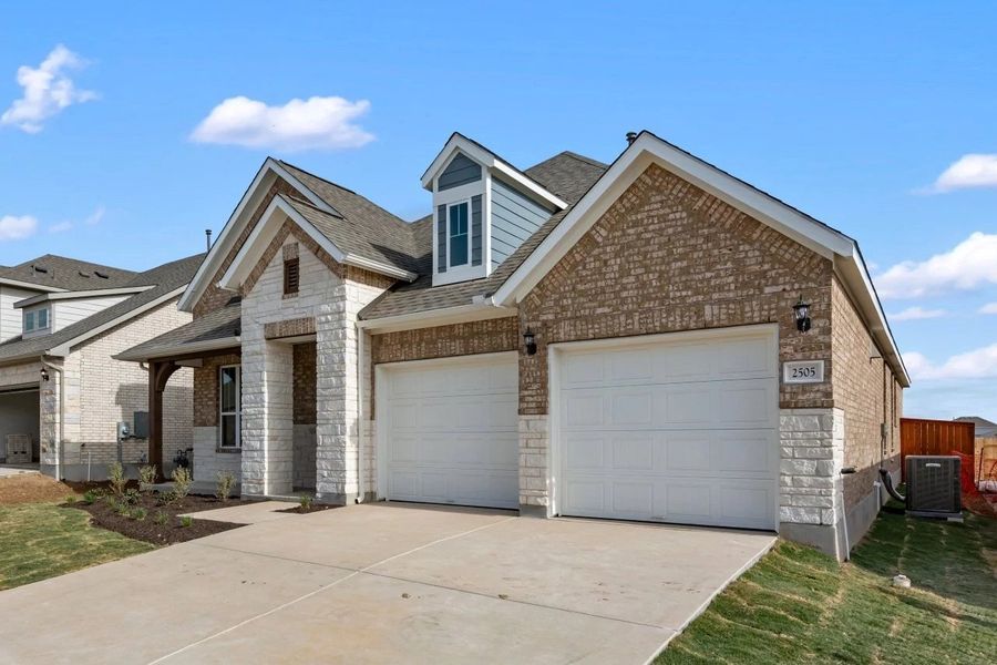 Front exterior of a new home in Berry Creek Highlands, Georgetown, TX, highlighting curb appeal (Image 22).