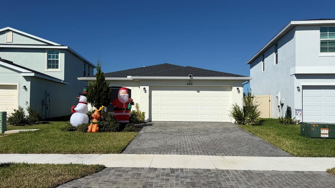 Front exterior of a new home in , Palm Bay, FL, highlighting curb appeal (Image 19). Front exterior of a new home in , Palm Bay, FL, highlighting curb appeal (Image 19).