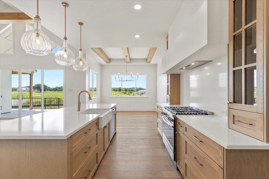 Custom cabinetry, quartz counters and views galore. Custom cabinetry, quartz counters and views galore.