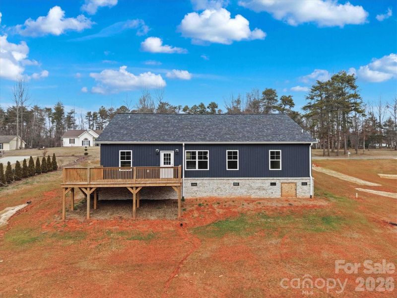 Deck overlooking the spacious backyard