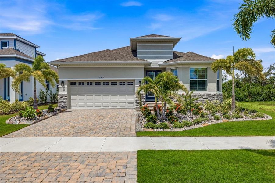 Front exterior of a new home in , Apollo Beach, FL, highlighting curb appeal (Image 22). Front exterior of a new home in , Apollo Beach, FL, highlighting curb appeal (Image 22).