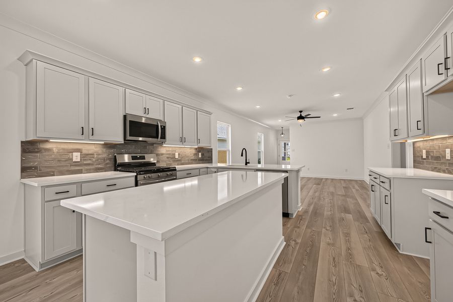 Furnished interior view inside a new home in Aldeana, Bonney (Image 10).