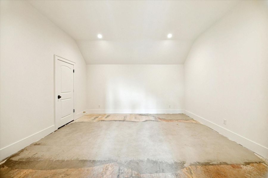 Large upstairs flex/media room with recessed lighting, ready for customization.