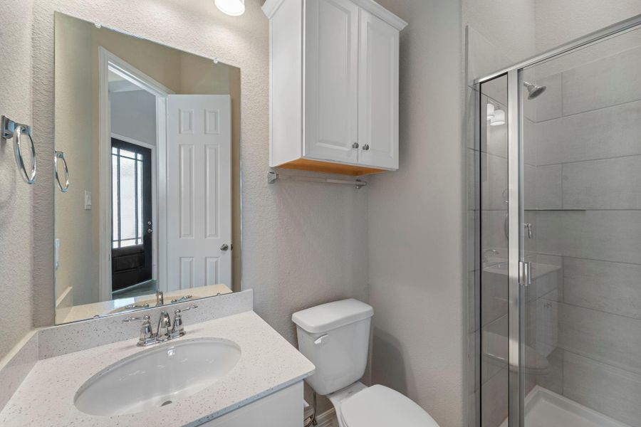 The secondary bath features tile flooring, white cabinetry and light countertops and a shower/tub combo. Perfect for accommodating any visiting family and friends. The secondary bath features tile flooring, white cabinetry and light countertops and a shower/tub combo. Perfect for accommodating any visiting family and friends.