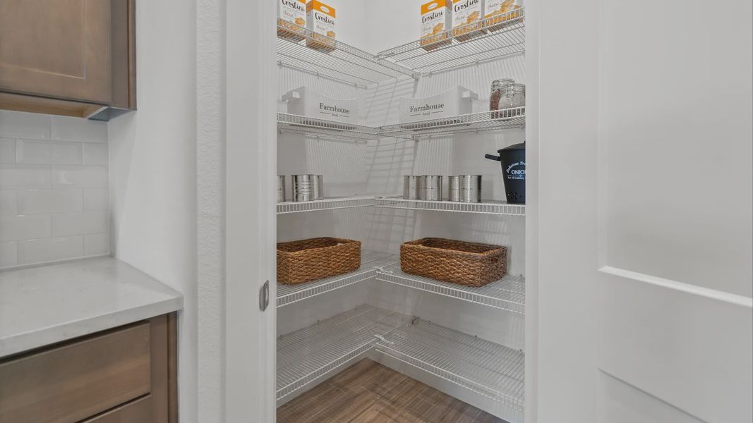 Kitchen corner pantry in a DRB Home Clementine model at the Trinity Place community.
